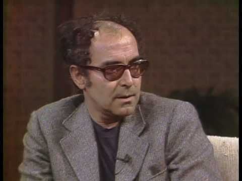 Photo of set Jean-Luc Godard reading Hannah Arendt's 'The Nature of Totalitarianism'.